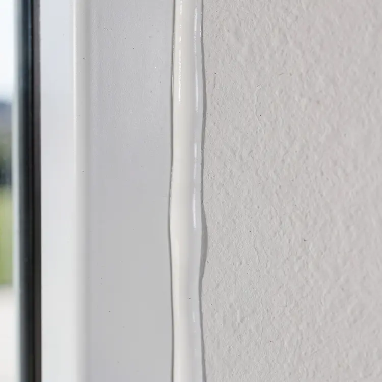 Professional Window Caulking Close-Up