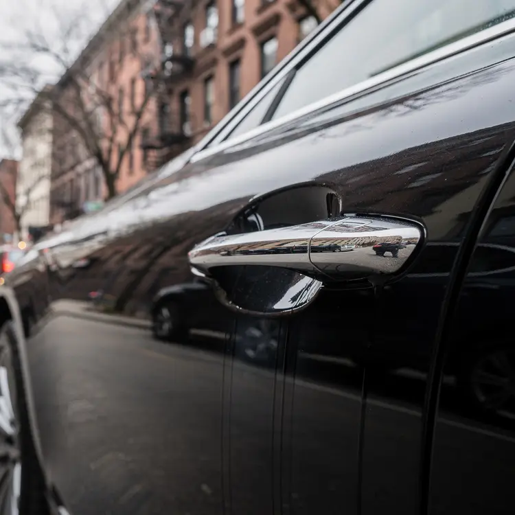Black Sedan Door Handle Close-Up – Urban Detail