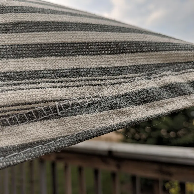 Repaired Canvas Awning on Wooden Deck