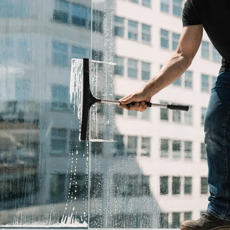 Commercial Window Washer Cleaning Glass Facade