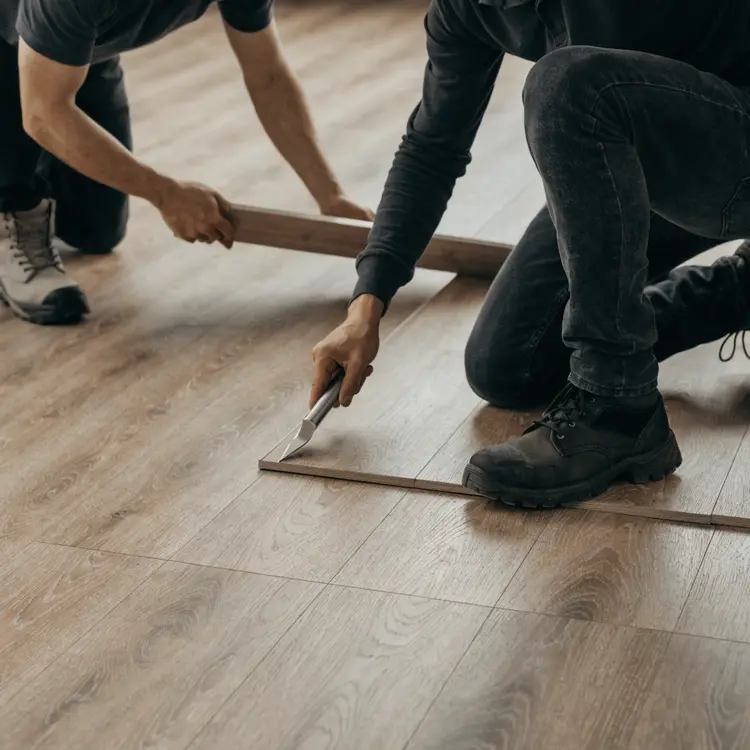 Flooring Installation by Two Workers