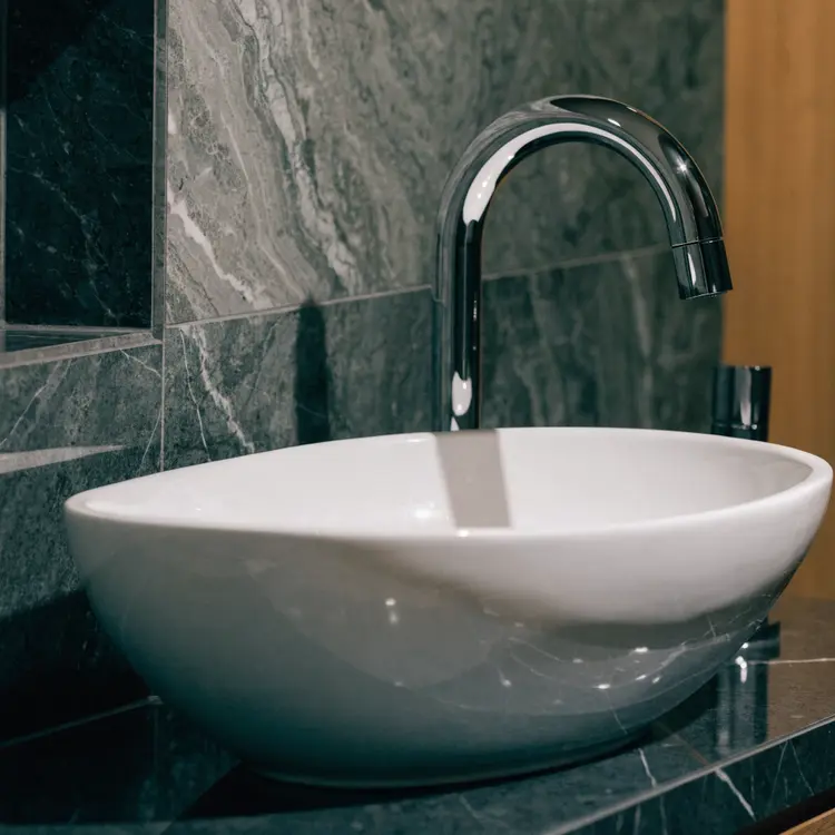Luxury Vessel Sink with Chrome Faucet on Marble Countertop