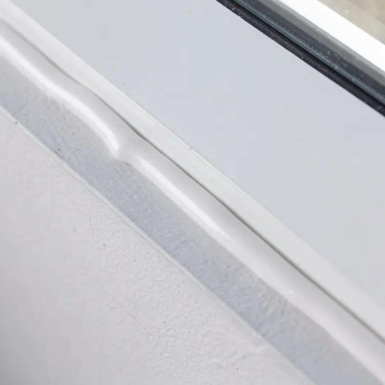 Window Frame Caulking Close-Up
