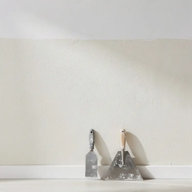 Plastering Tools Against Freshly Finished Interior Wall
