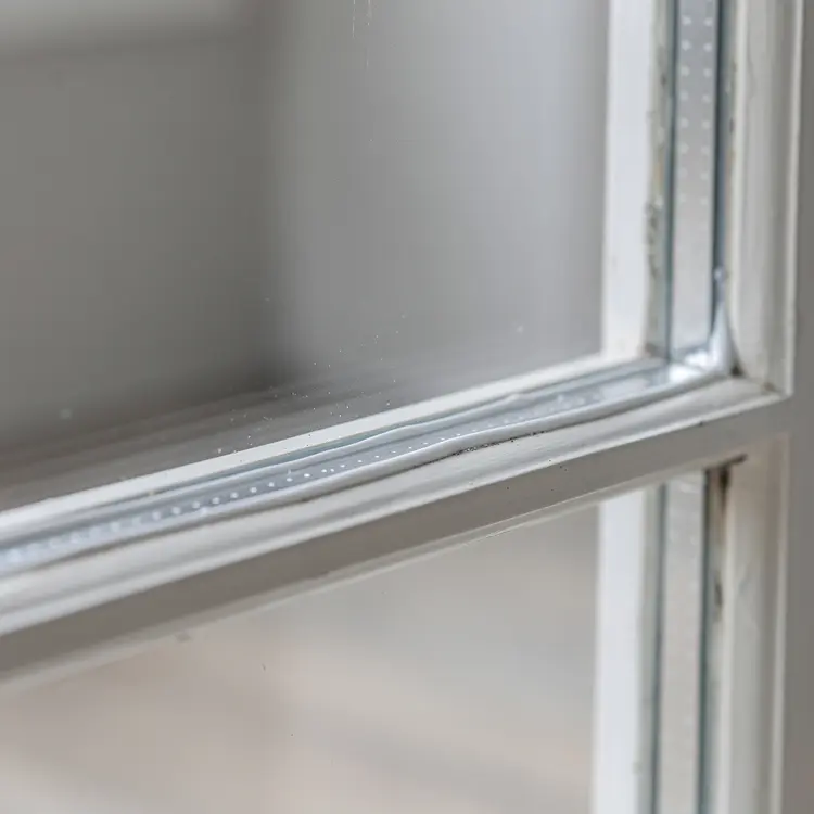 Close-Up Window Frame Caulking Detail