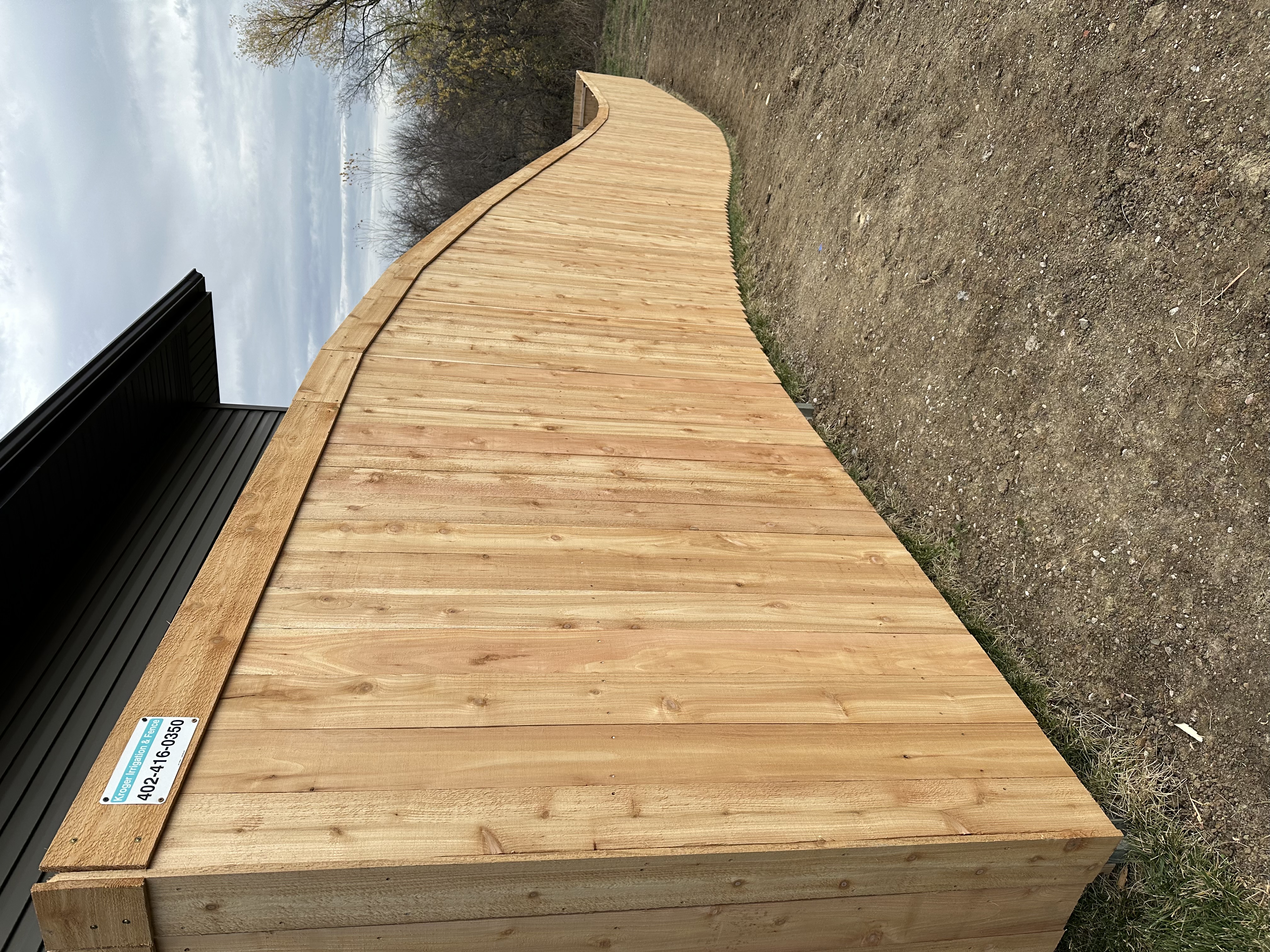 Custom Cedar Wood Privacy Fence with Curved Top Rail