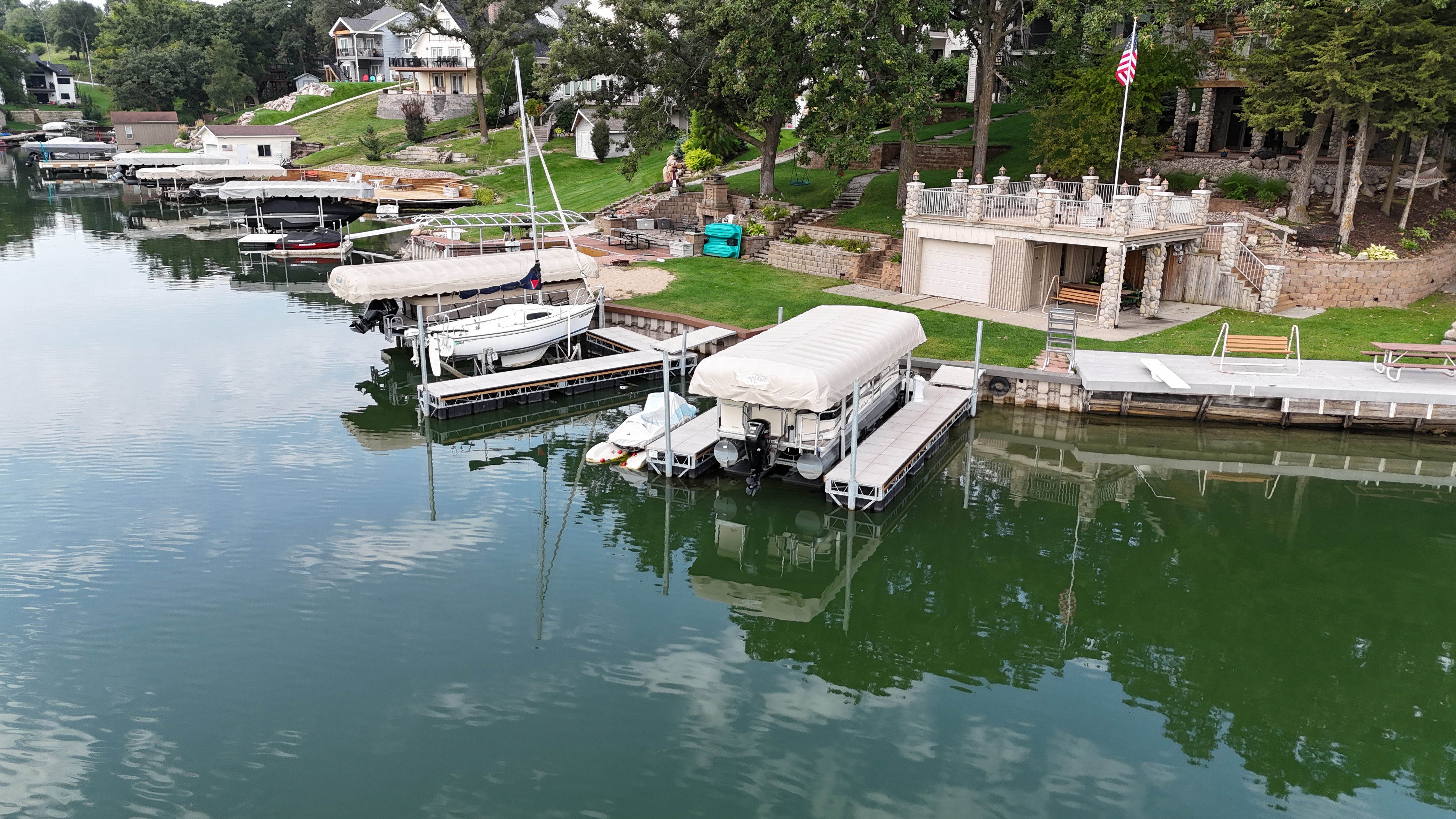 Covered Boat Lift & Floating Dock Installation on the Lake