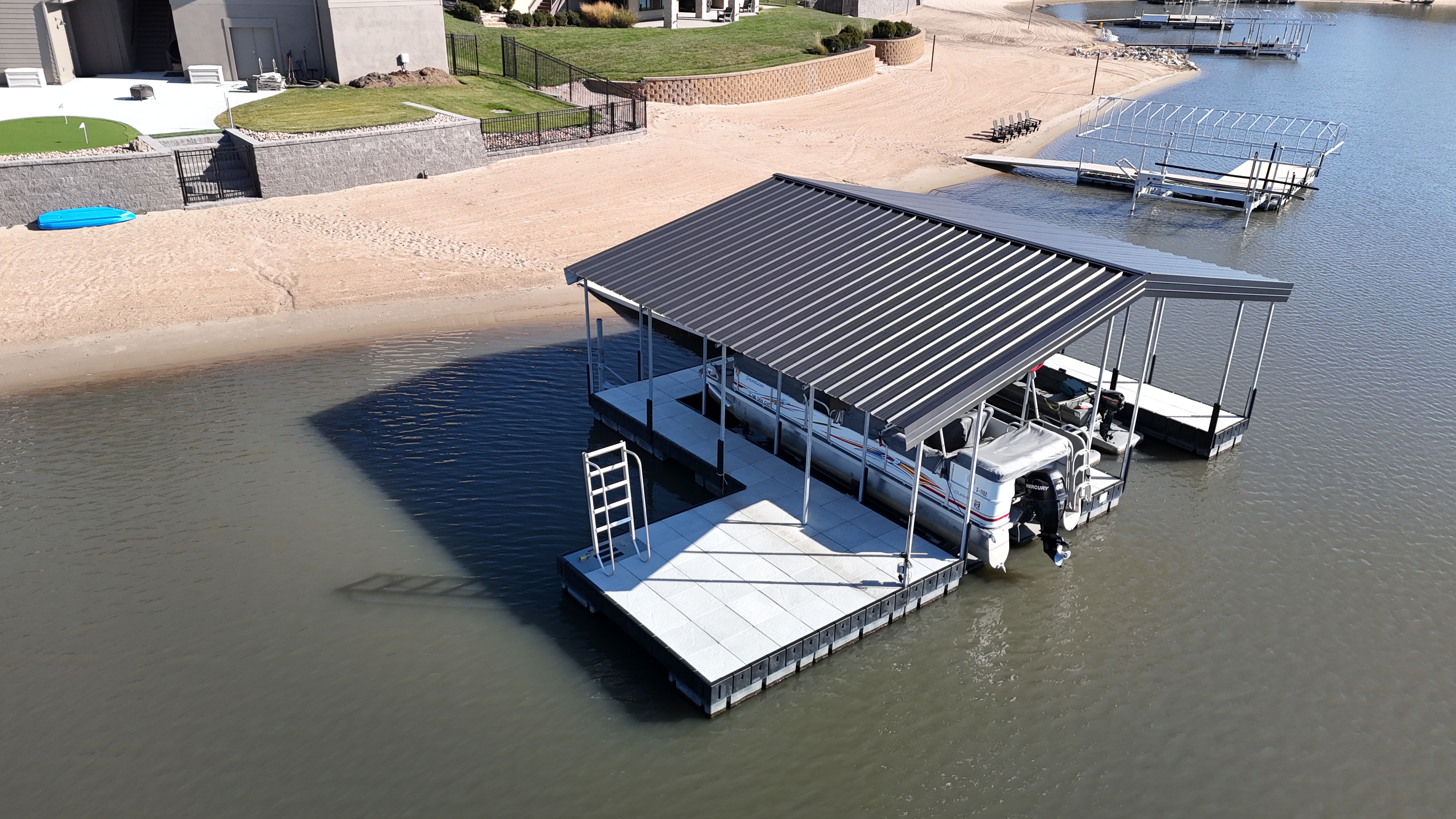 Covered Floating Dock with Dual Boat Slip Installation