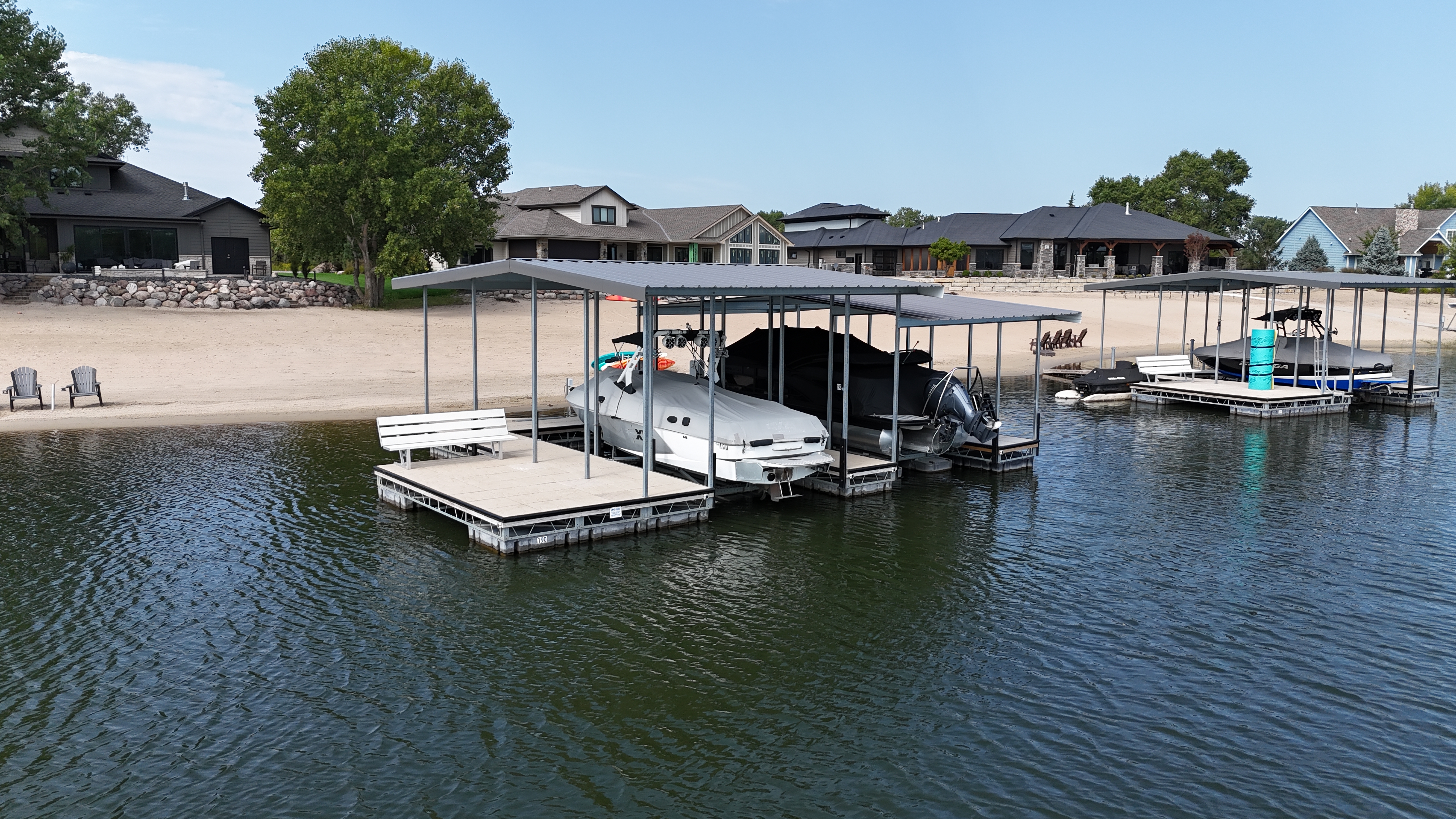 Floating Dock with Dual Canopy Boat Lifts on Lakefront Property