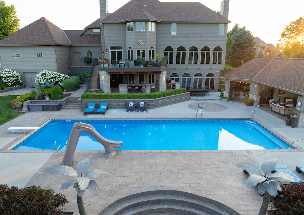 Luxury Backyard Pool Landscaping & Stamped Concrete Patio