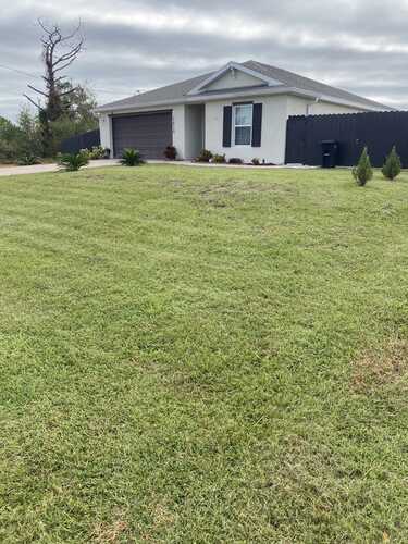 Freshly Mowed Front Lawn – Cape Coral Residential Property