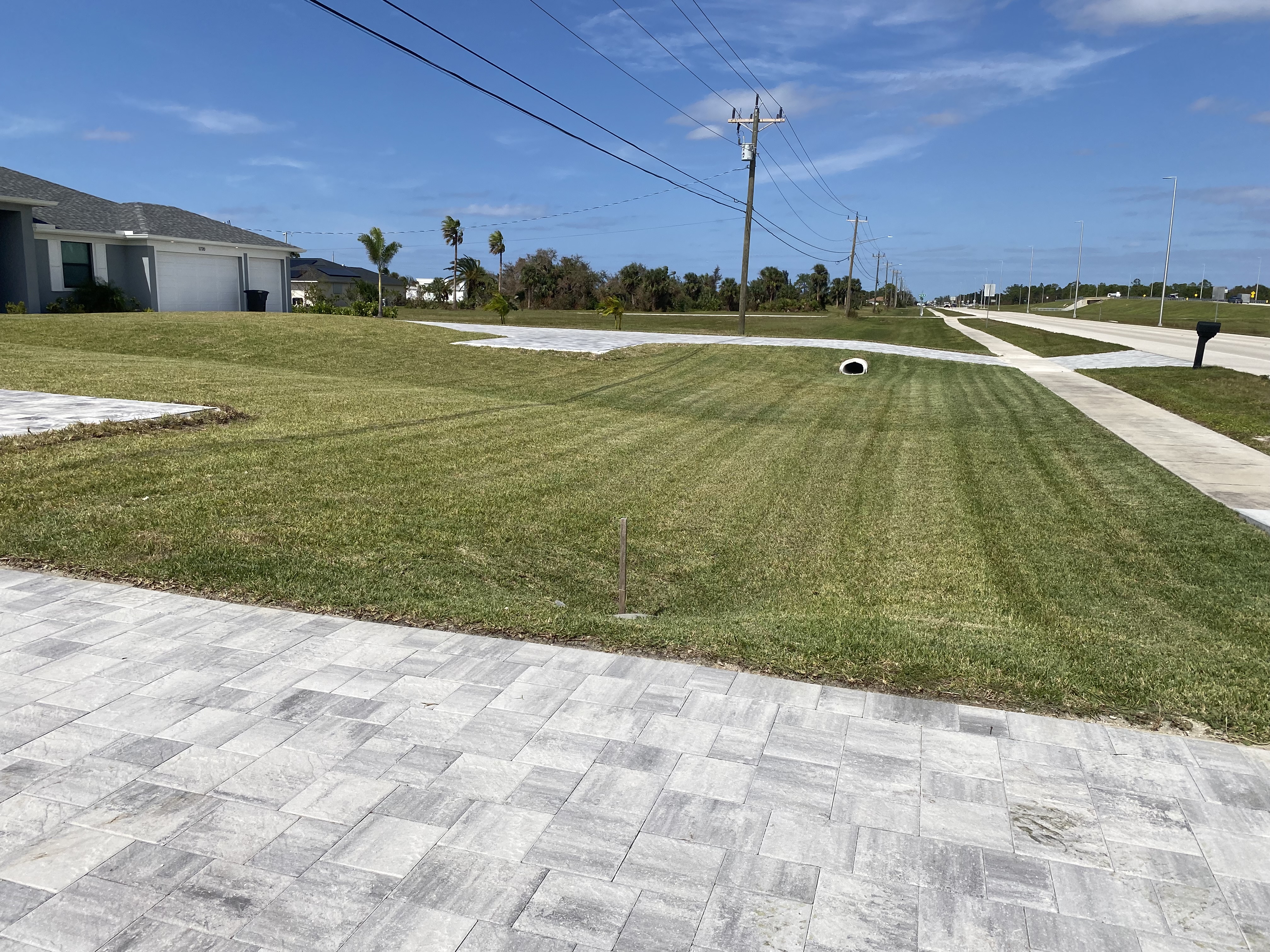 Freshly Mowed Front Lawn with Paver Driveway — Cape Coral, FL