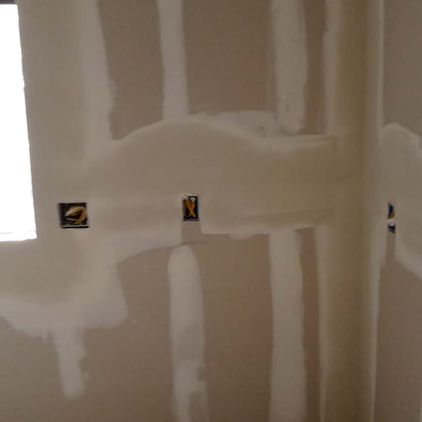 Drywall Taping and Mudding in Progress