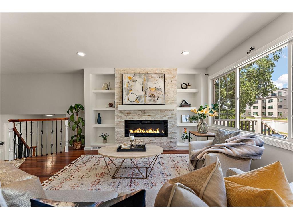 Spotless Living Room with Fireplace & Built-In Shelving