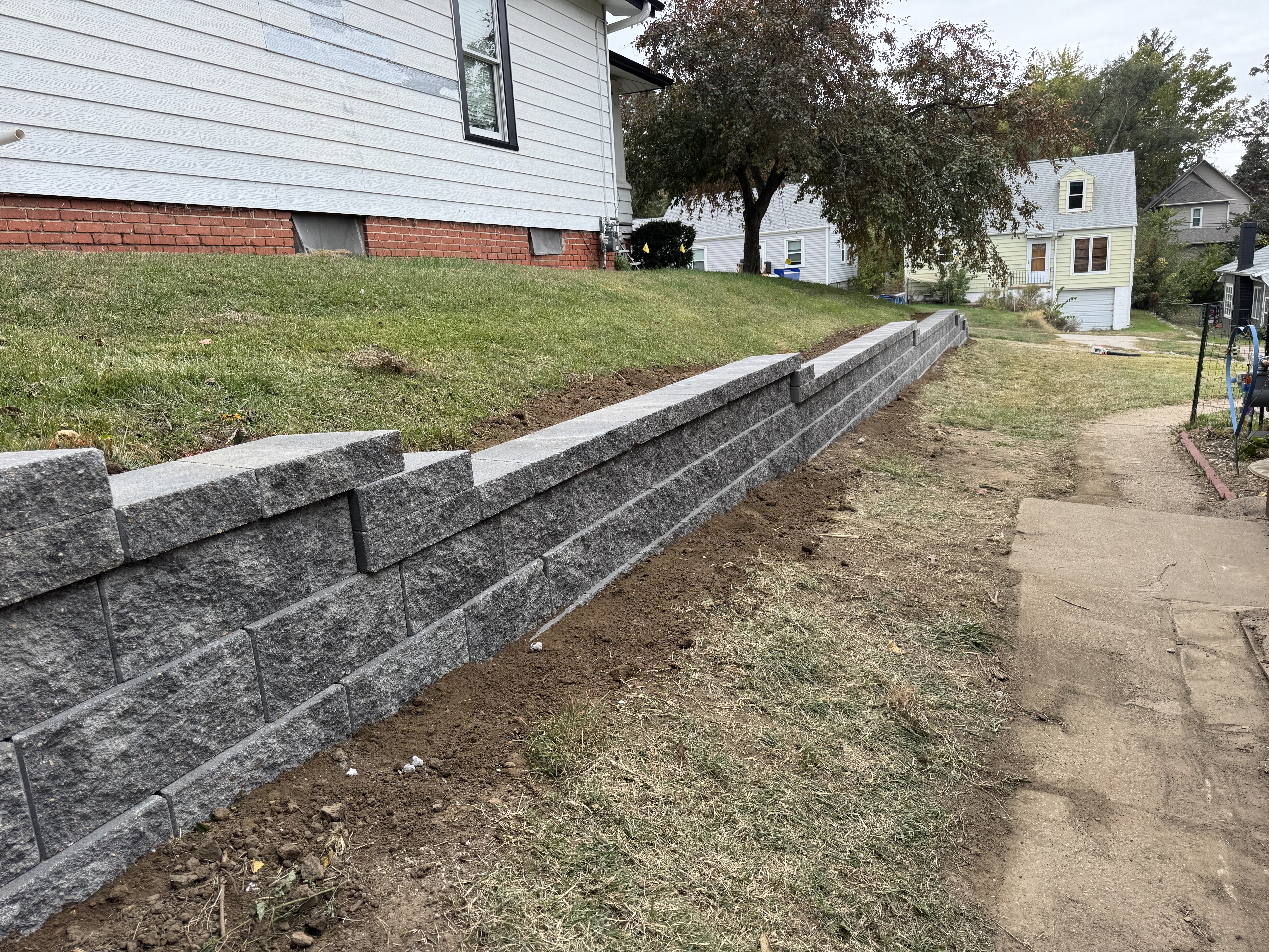 New Block Retaining Wall Installation – Front Yard Slope Retention
