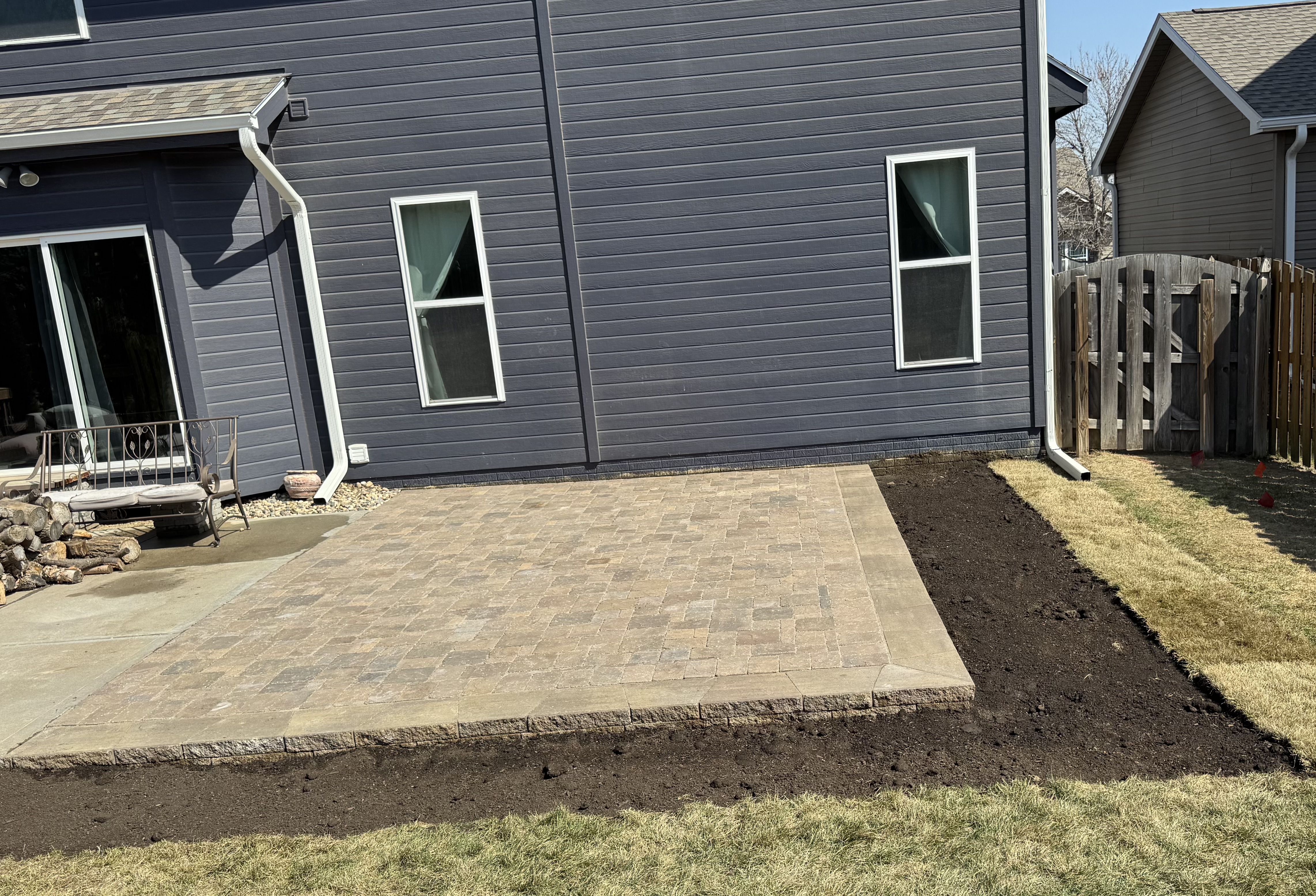 New Paver Patio with Block Retaining Wall Border