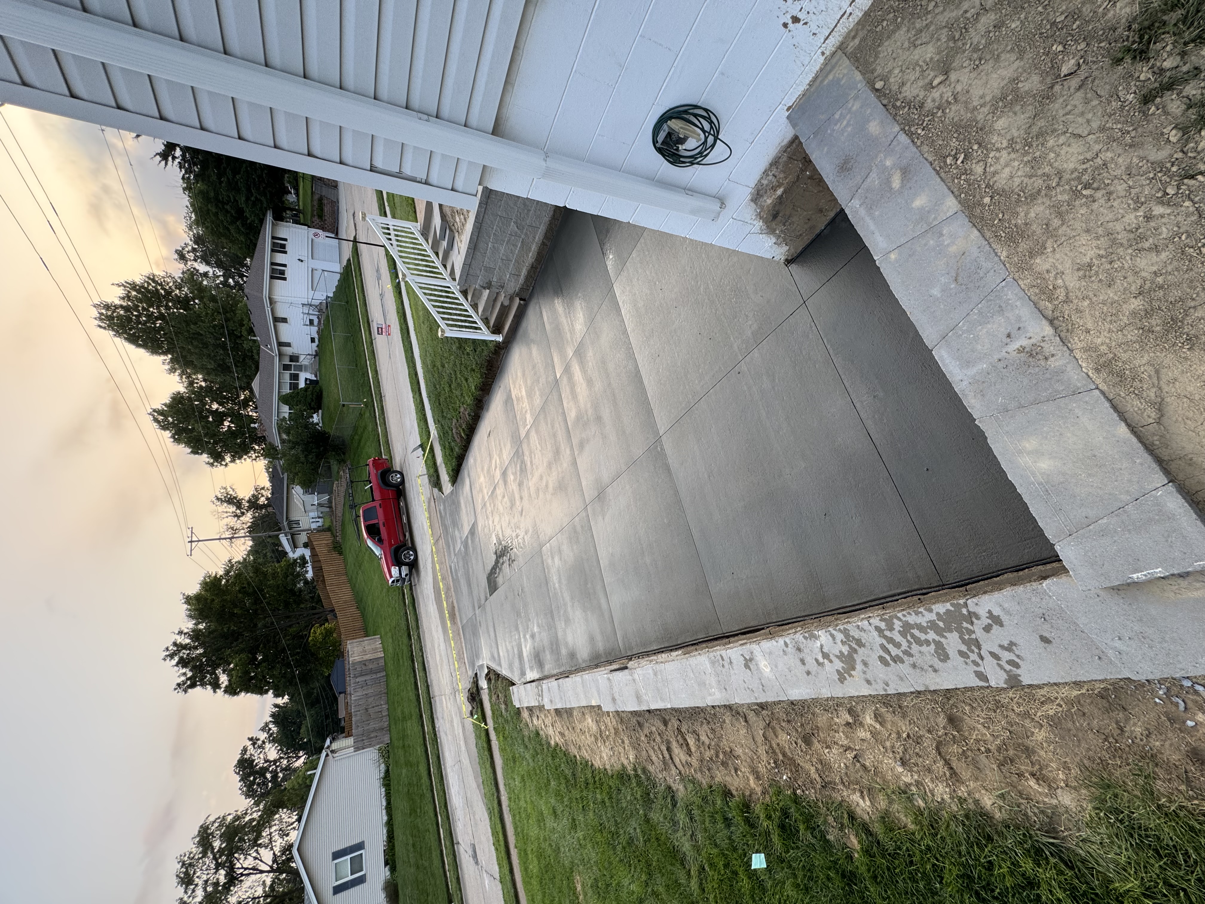 New Concrete Driveway with Block Retaining Wall Borders