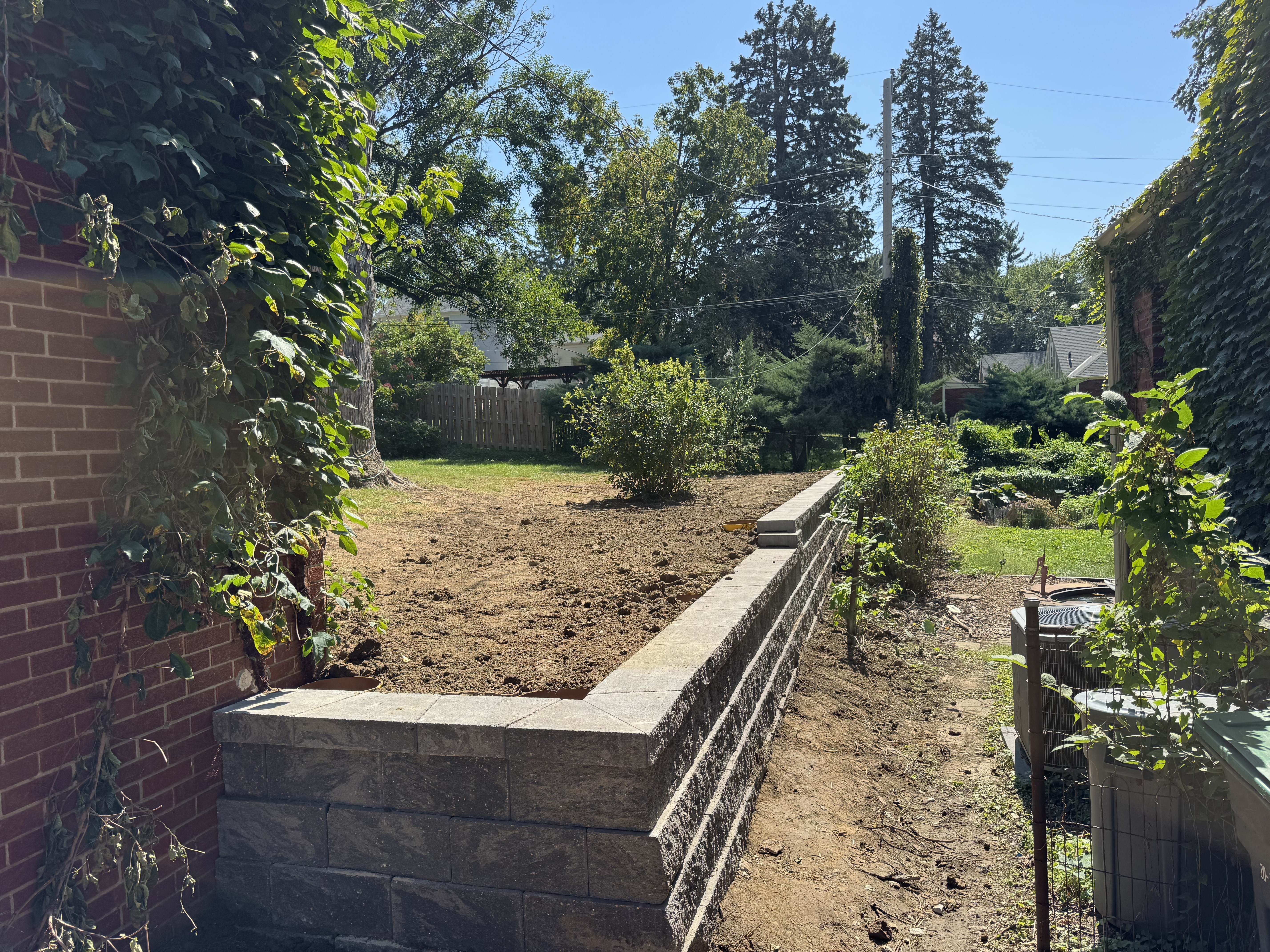 Block Retaining Wall with Backyard Grading and Site Prep