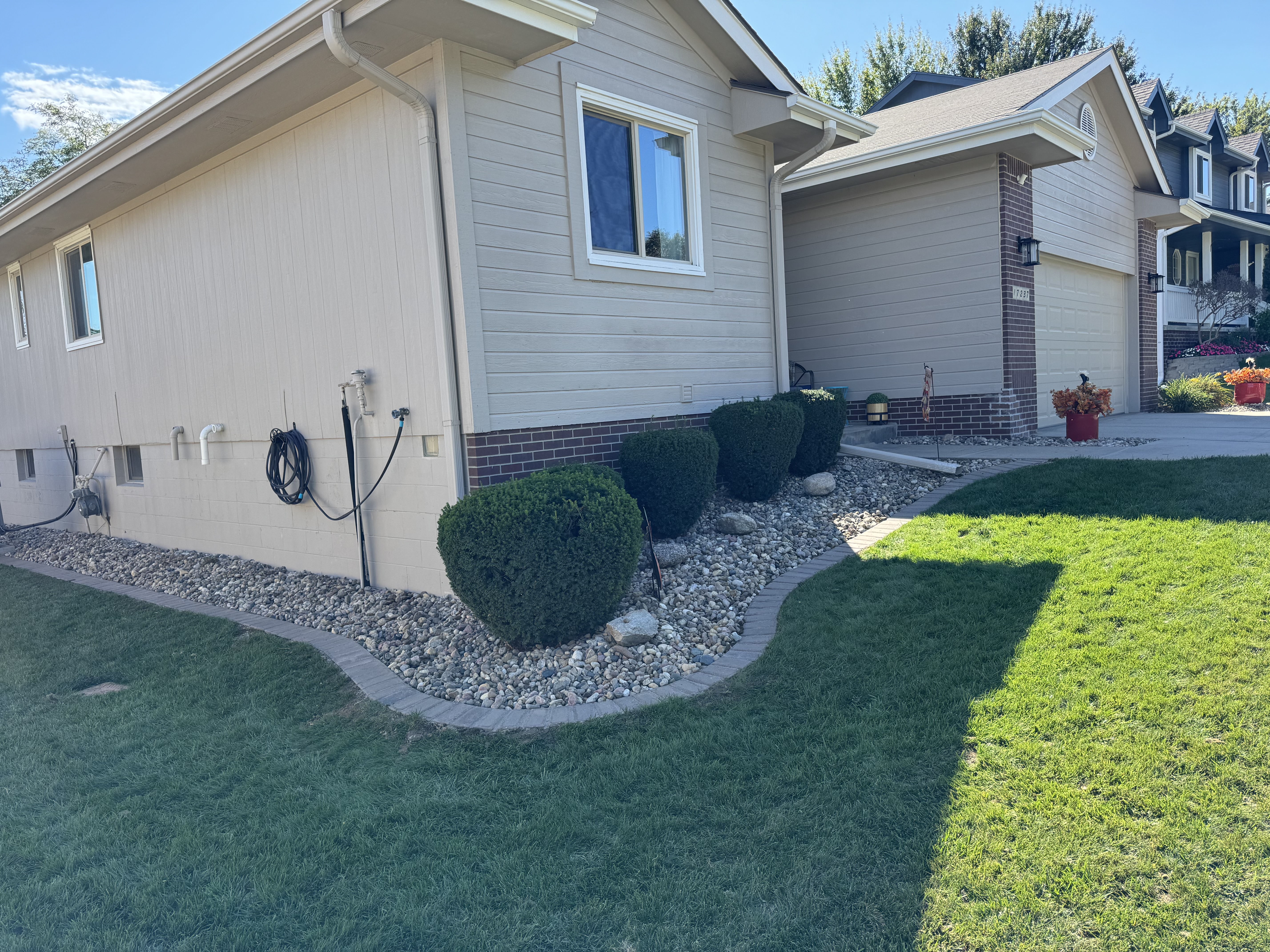 Curb Appeal Landscaping with Rock Beds and Paver Edging