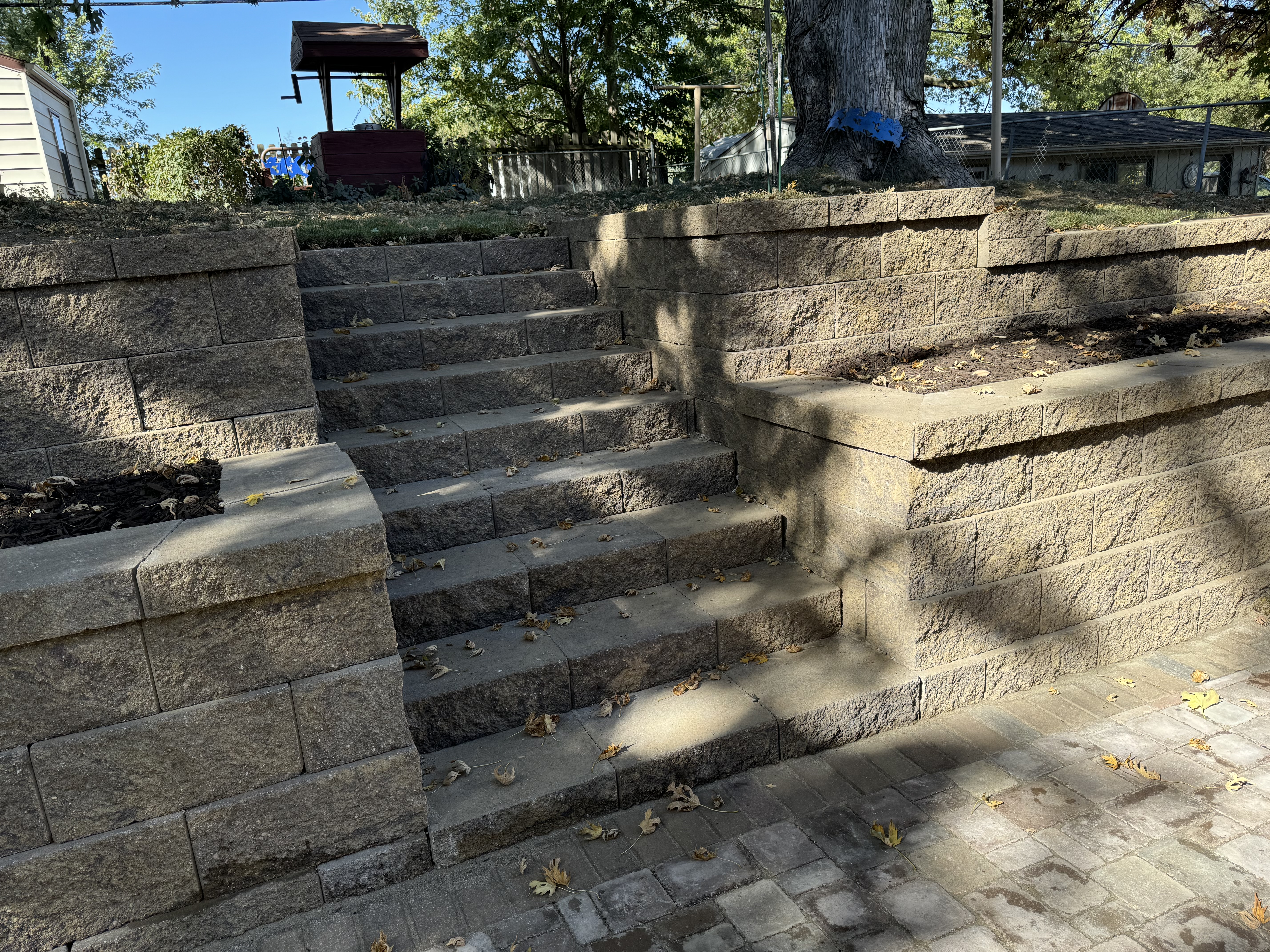 Multi-Tiered Block Retaining Wall with Steps and Paver Patio