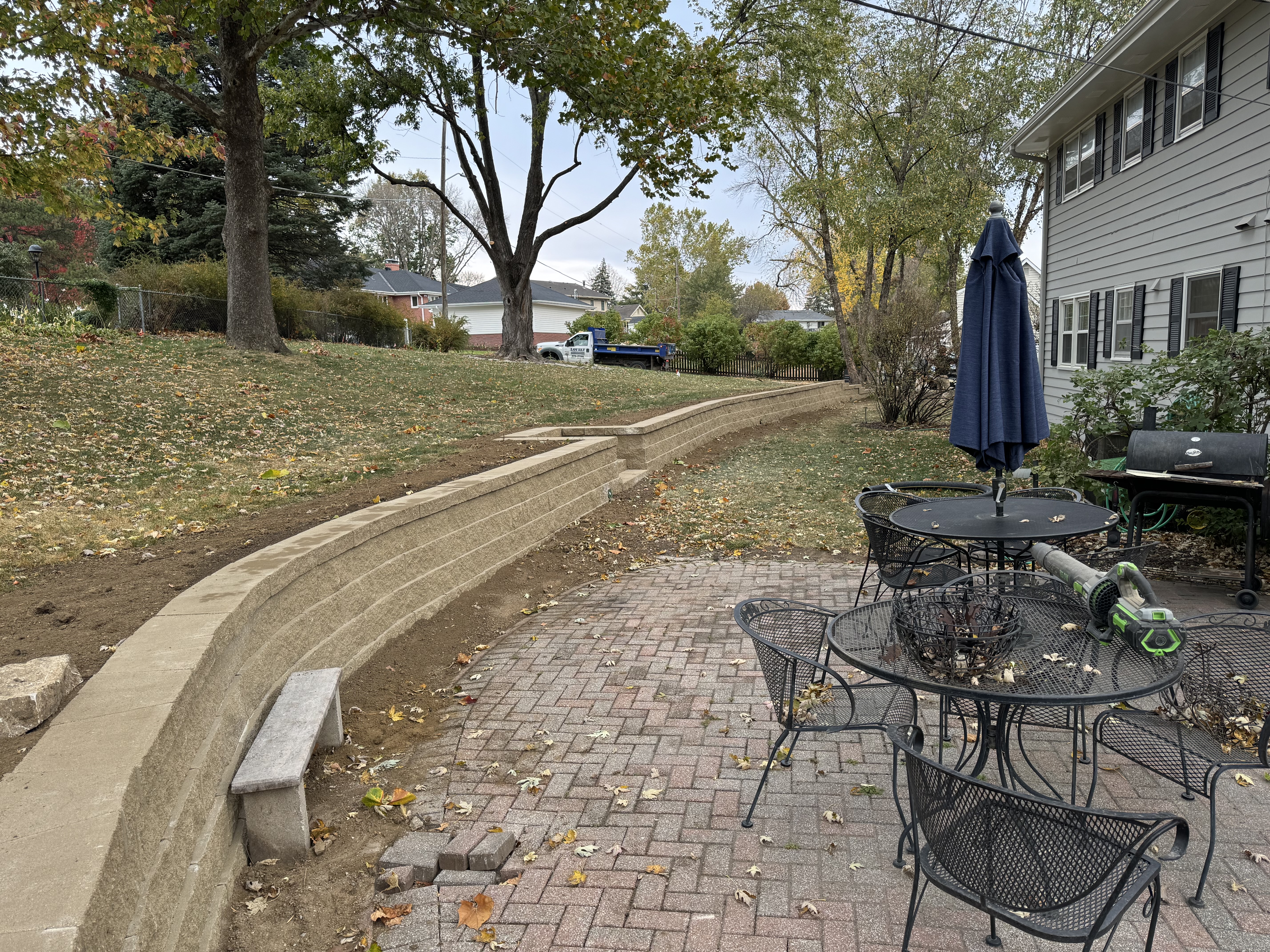 Curved Block Retaining Wall with Brick Paver Patio