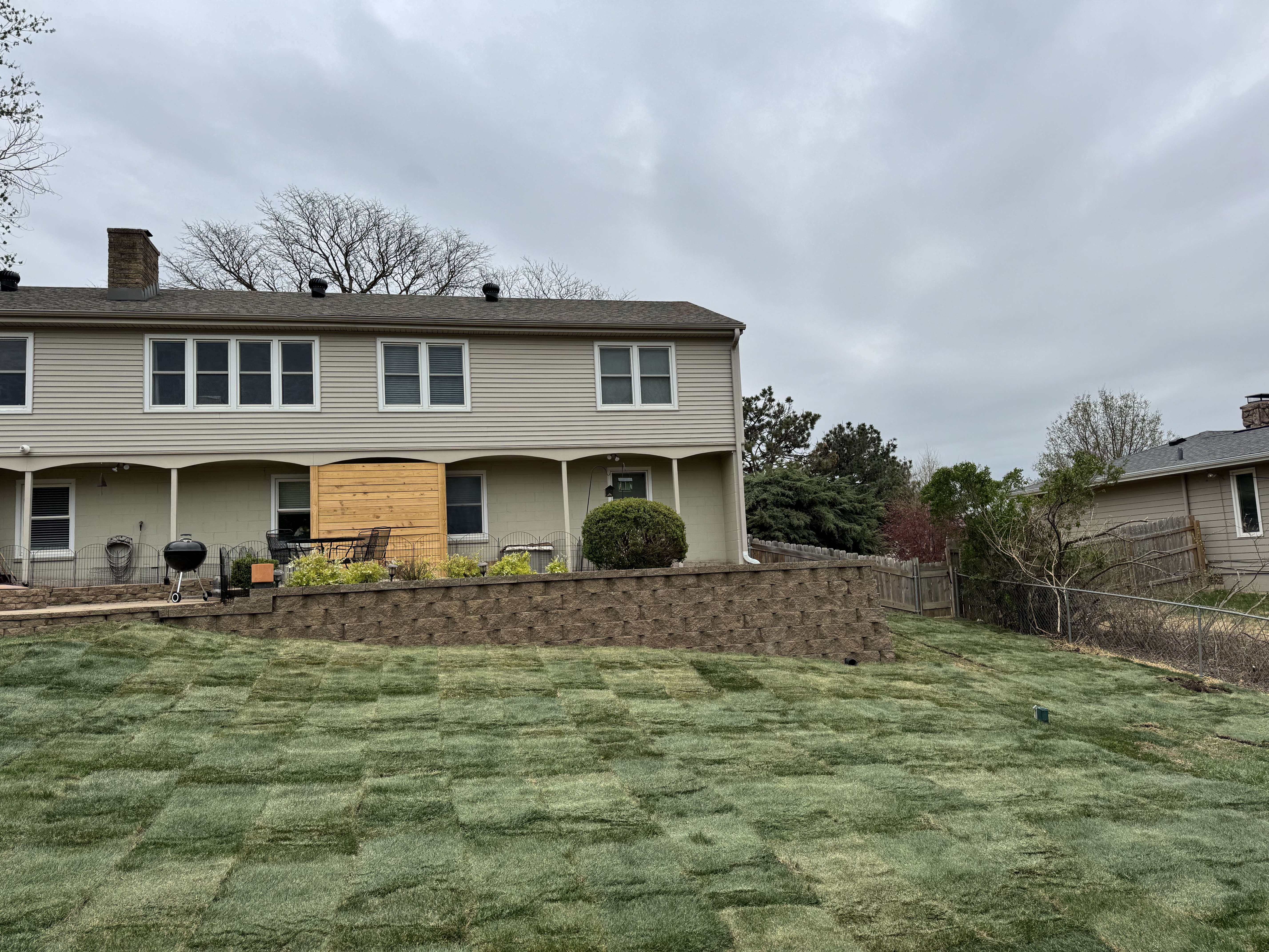 Block Retaining Wall with Backyard Sod Installation