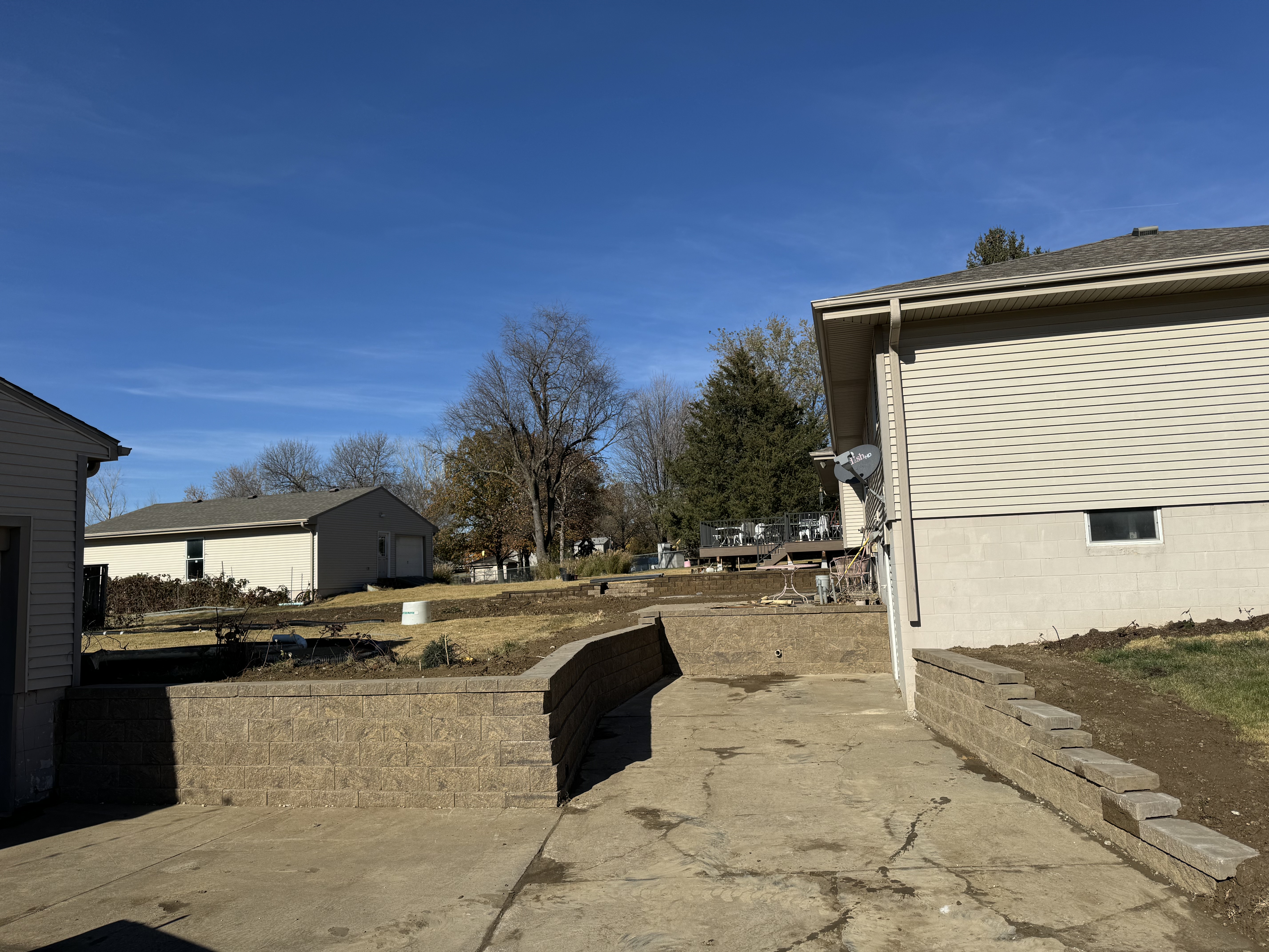 Tiered Block Retaining Wall & Concrete Patio Installation