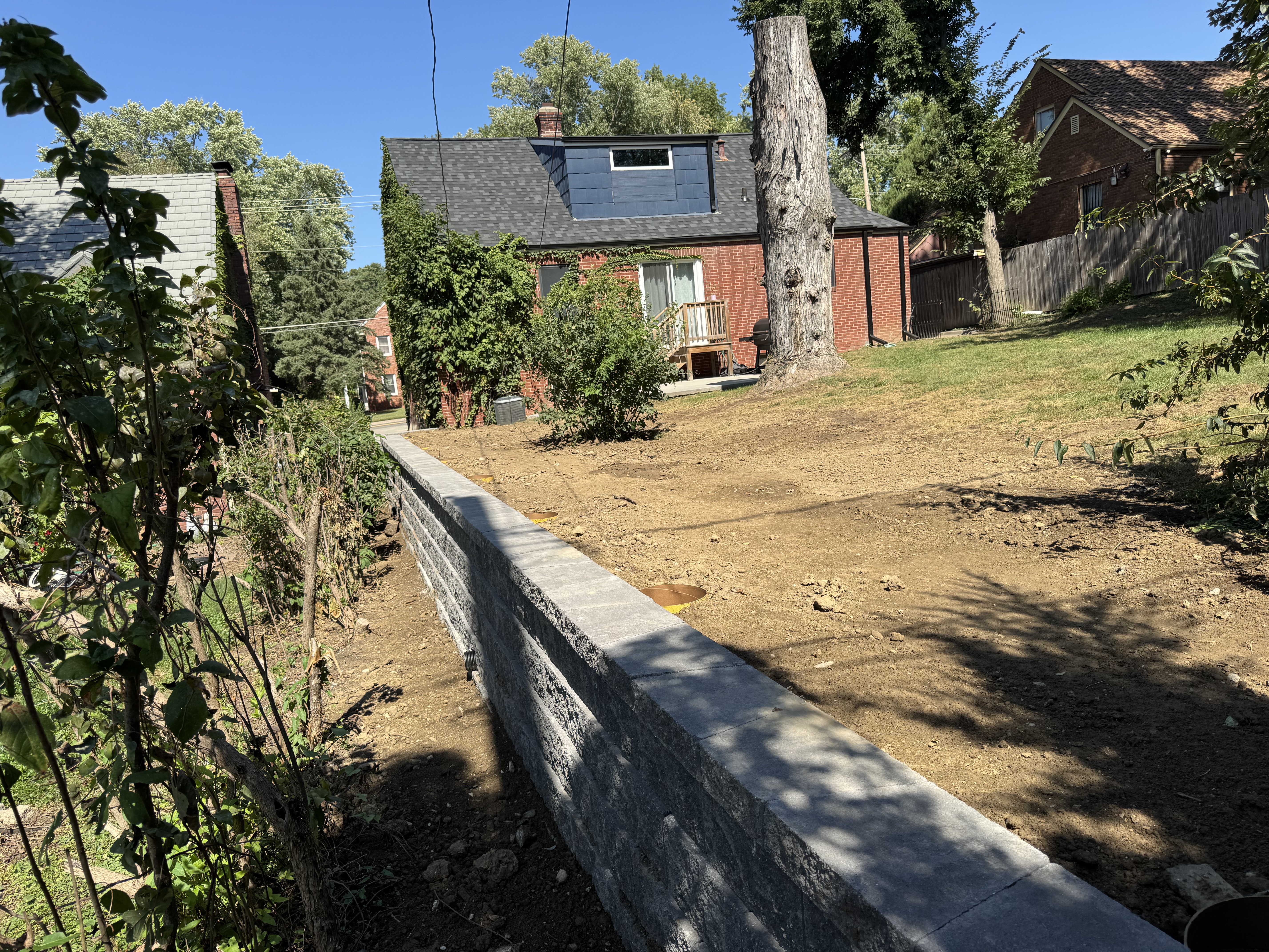 Block Retaining Wall with Graded Yard — Residential Landscaping Project