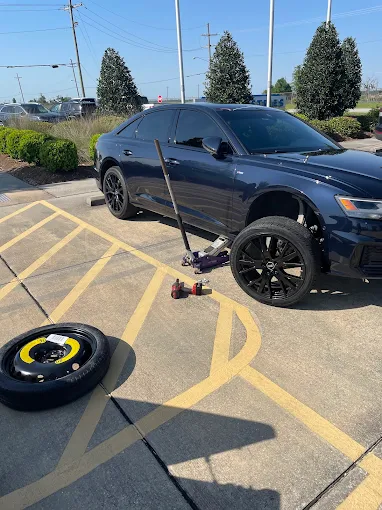 Mobile Tire Change on Black Audi SUV