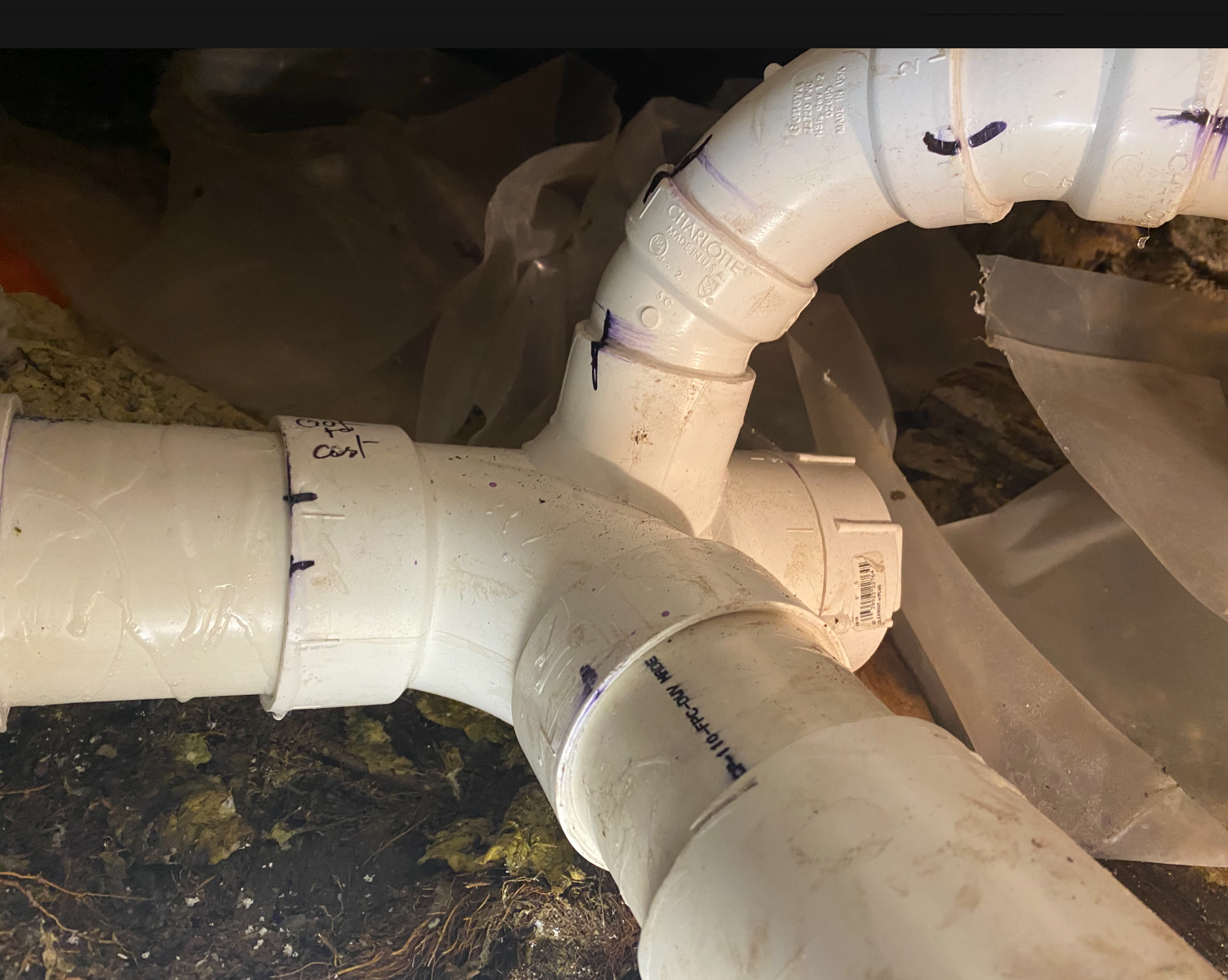 PVC Drain Line Fitting Installation in Crawl Space