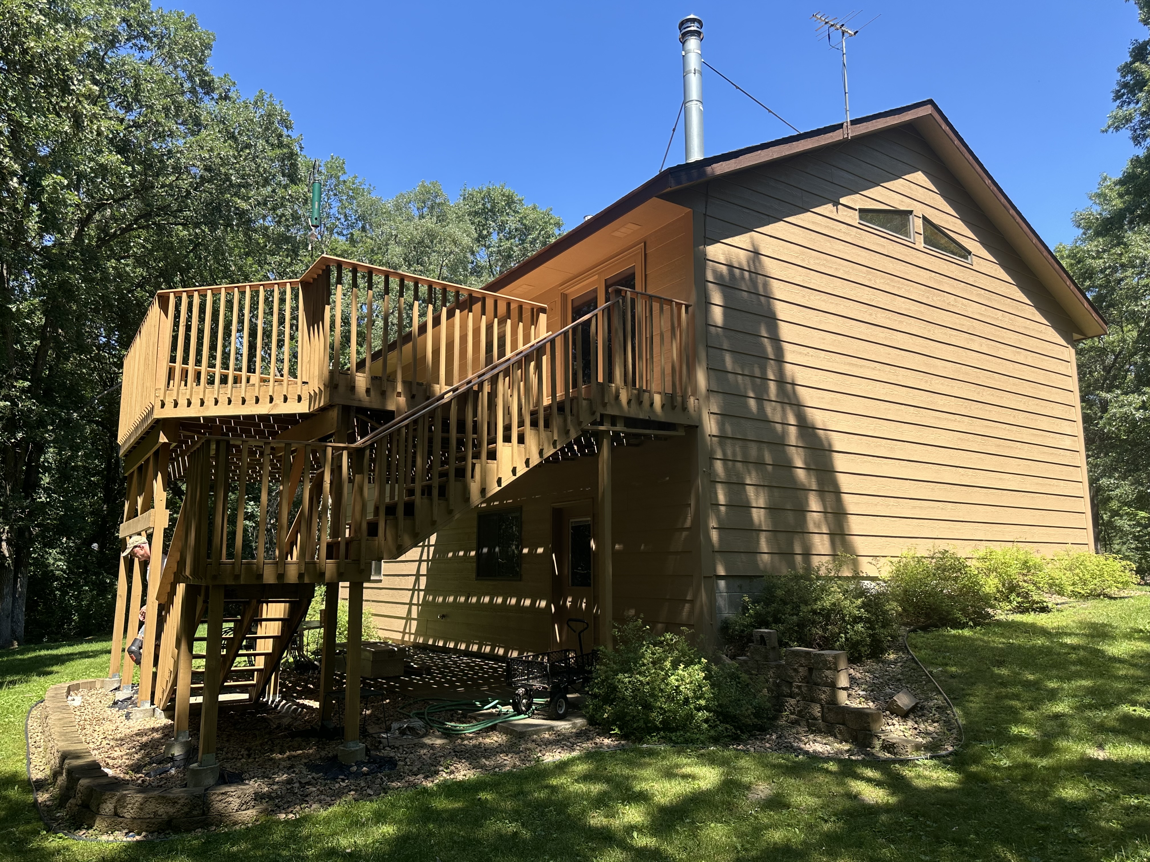 Two-Level Exterior Deck Painting – Wooded Cabin Home