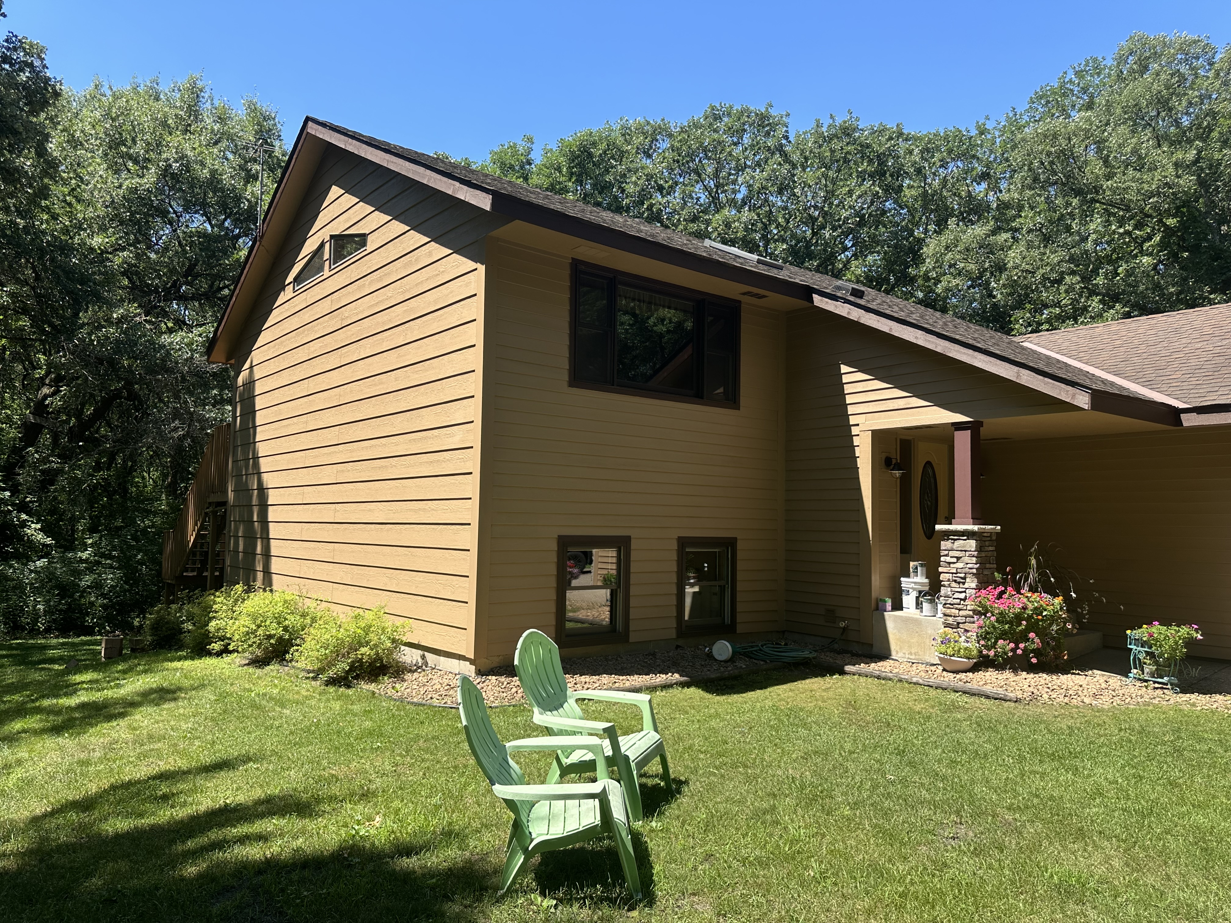 Exterior Home Painting – Tan Lap Siding with Dark Trim