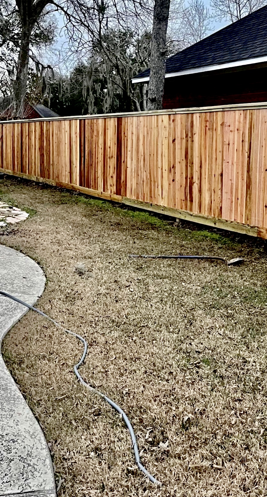 Lake Jackson Tx cedar pool fence cap and trim.jpg